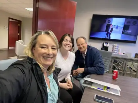 Happy Kentucky homebuyers celebrating loan approval at the office with Joel Lobb